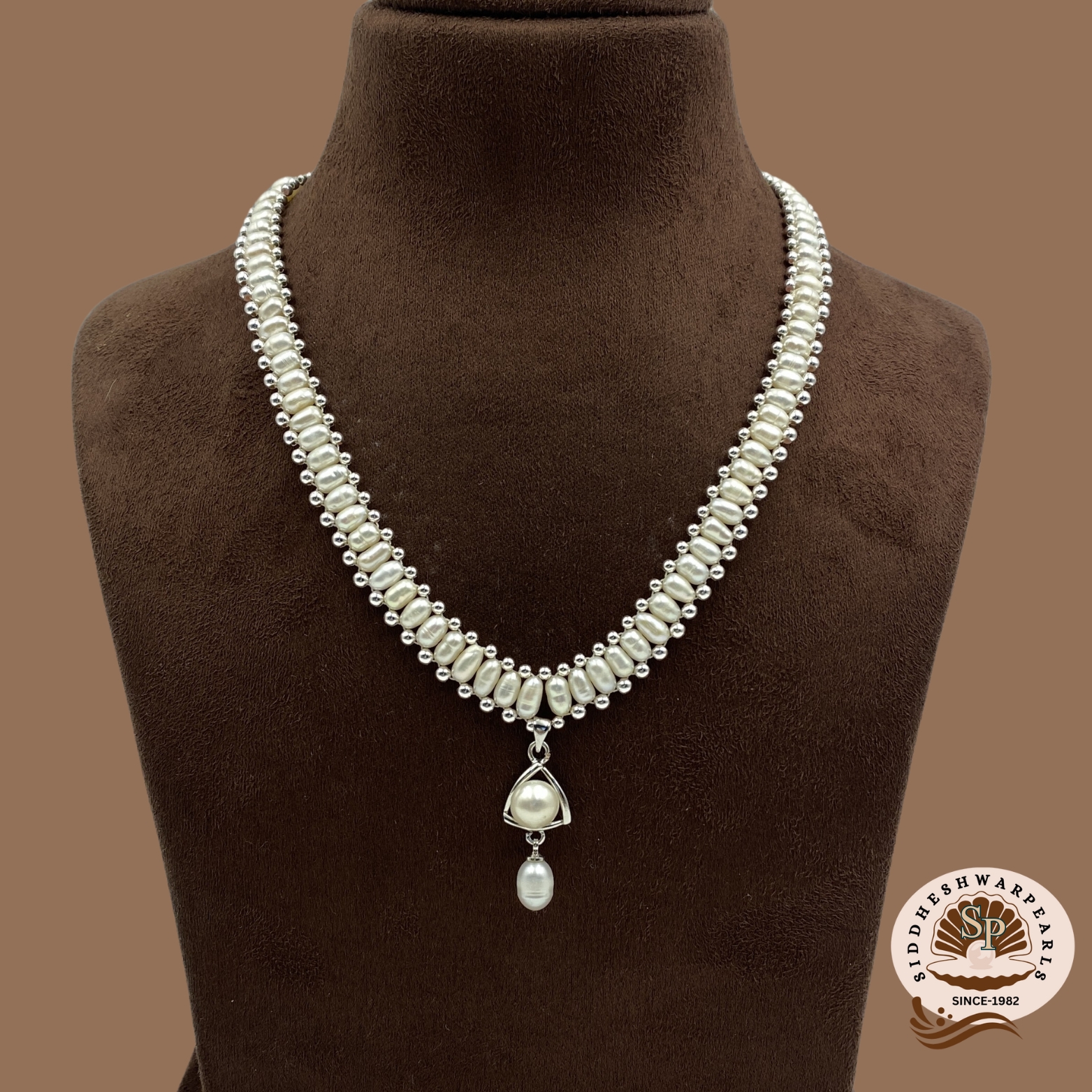 tri ch logo Chandani Pearl Set